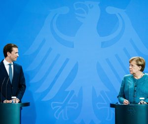 epa09438463 Austrian Chancellor Sebastian Kurz (L) and German Chancellor Angela Merkel look at each other during a joint press conference at the Chancellery in Berlin, Germany, 31 August 2021. German Chancellor Merkel and Austrian Chancellor Kurz met for bilateral talks.  EPA/CLEMENS BILAN