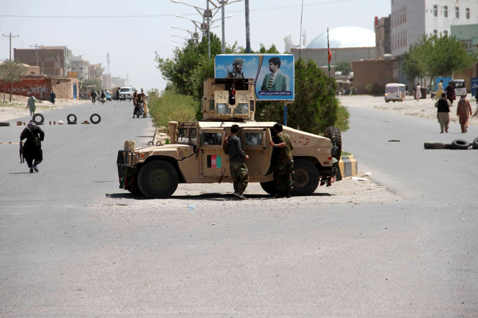 epa09400533 Afghan security officials patrol after they took back control of parts of Herat city following intense battle with Taliban militants, in Herat, Afghanistan, 06 August 2021. Heavy fighting continued in Kandahar, Lashkargah, and Herat cities as the Taliban continued pressing on with their surge in Afghanistan and breaking through a tough resistance by the government forces. The fighting in Herat displaced hundreds of families as people left their houses to seek refuge in central parts of the city, mostly settling with relatives.  EPA/JALIL REZAYEE