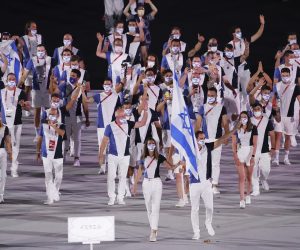 Israel's delegation members attend the Parade of Athletes during the Opening Ceremony of the Tokyo 2020 Olympic Games at National Stadium in Tokyo on July 23rd, 2021. Eleven thousand people coming from two hundred six countries and regions will participate in the event.( The Yomiuri Shimbun via AP Images )