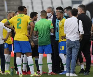 Brazil's coach Tite talks with Argentina's Lionel Messi and Brazil's Neymar as the soccer game is interrupted by health authorities during a qualifying soccer match for the FIFA World Cup Qatar 2022 at Neo Quimica Arena stadium in Sao Paulo, Brazil, Sunday, Sept.5, 2021. Federal police and health agency officers interrupted the South American classic between the Brazilian and Argentine soccer teams after six minutes of play, in an operation that investigates the irregular entry of four players of Argentina into the country. (AP Photo/Andre Penner)