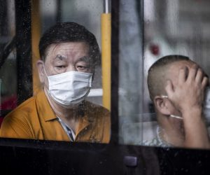 epa09413168 People wearing face masks for protection seat in a bus in Shanghai, China, 14 August 2021. According to the National Health Commission report on 14 August, there are 30 new locally transmitted  COVID-19 cases, including 18 in Jiangsu province, 4  in Henan, 4 in Hubei, 3 in Hunan, and 1 in Yunnan.  EPA/ALEX PLAVEVSKI
