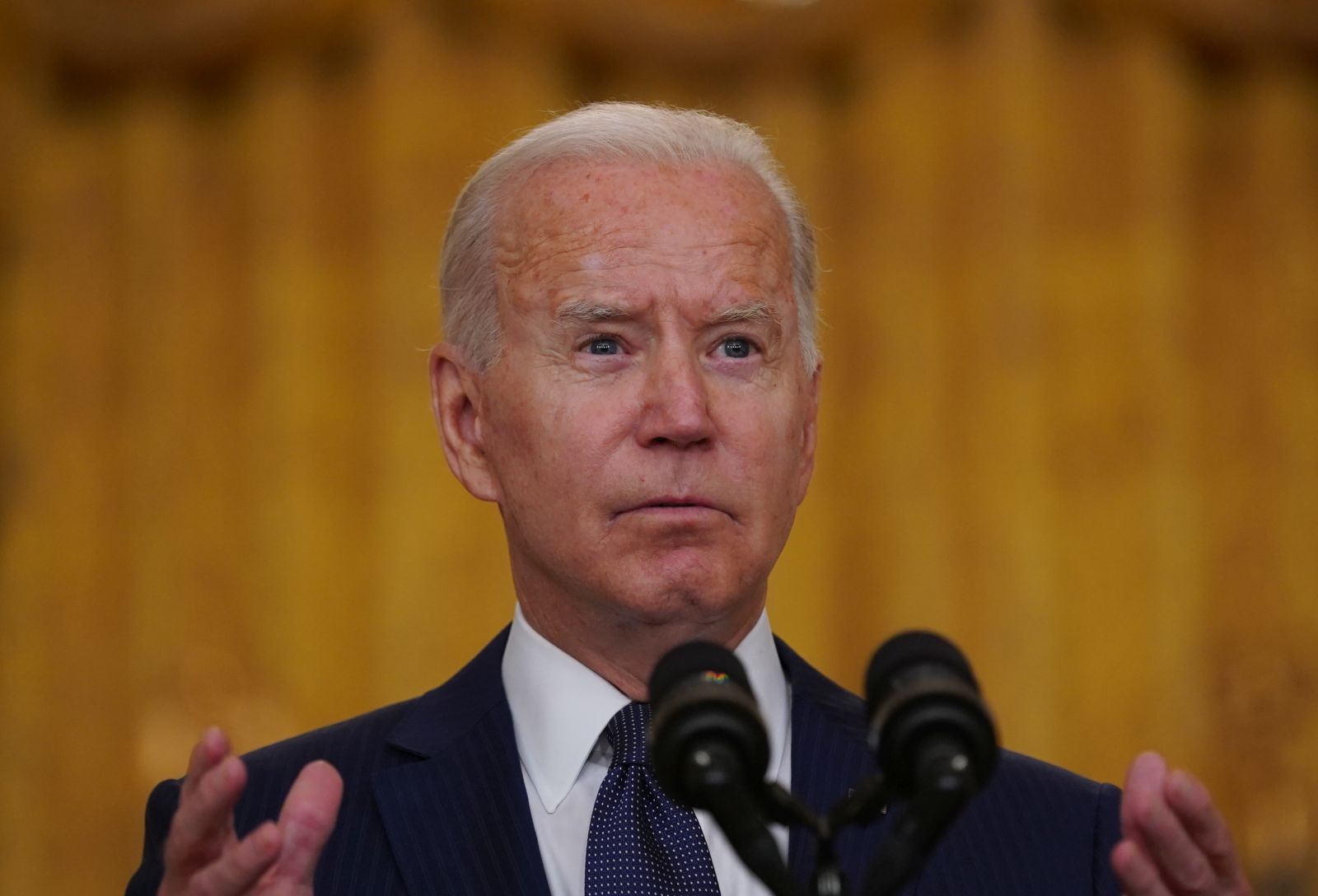 epa09431365 US President Joe Biden delivers remarks on the terror attack at Hamid Karzai International Airport in Kabul Afghanistan, and the US service members and Afghan victims killed and wounded, from the East Room of the White House in Washington, DC, USA, 26 August 2021.  EPA/Stefani Reynolds / POOL