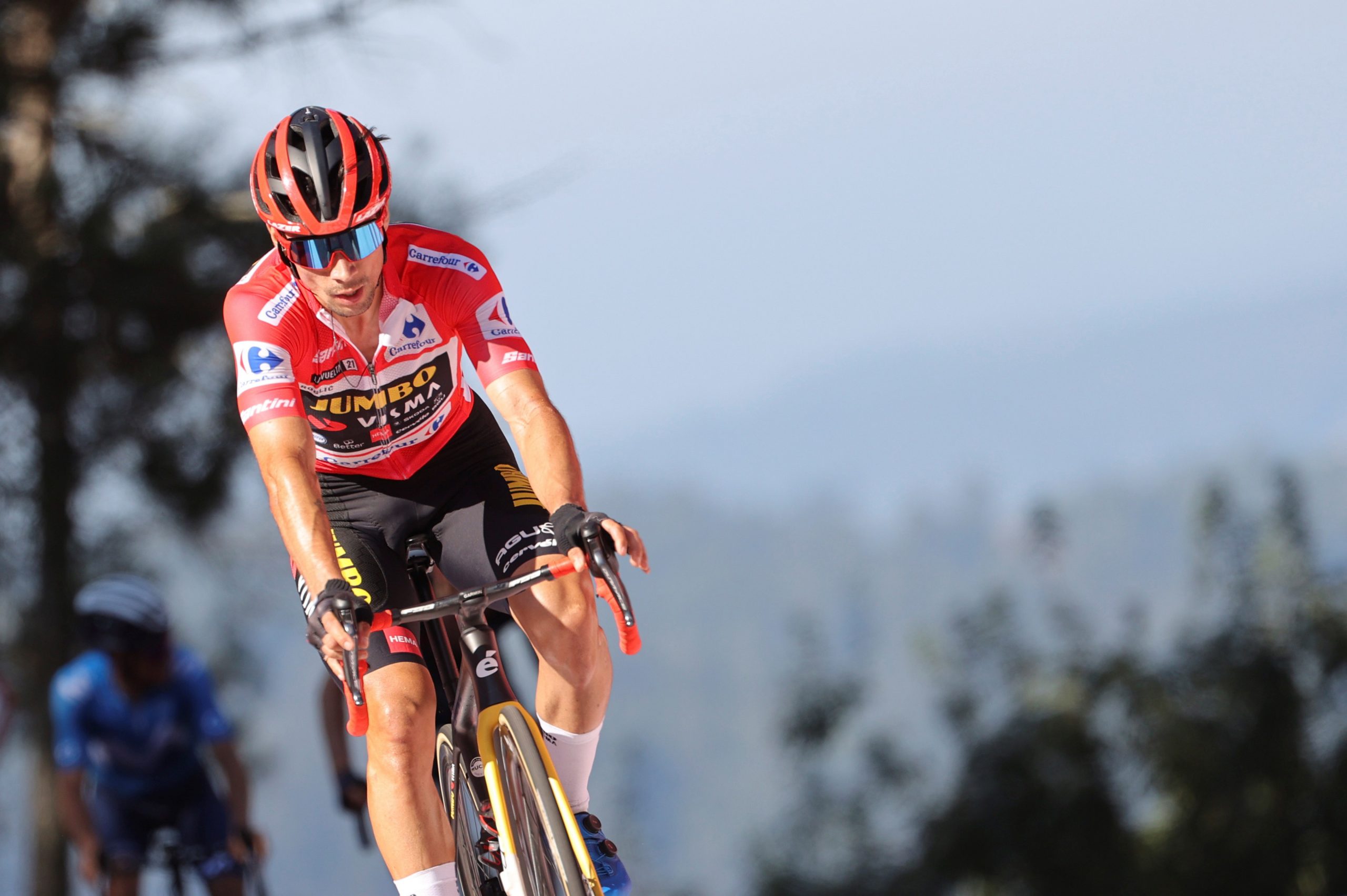 epa09447475 Overall leader Slovenian Primoz Roglic, Jumbo-Visma, in action during the 20th stage of the Spanish Cycling Vuelta, a 202.2km-long race between Sanxenxo and Castro de Herville in Galicia, Spain, 04 September 2021.  EPA/Manu Bruque