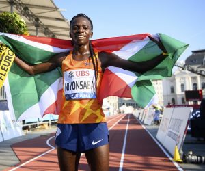 epa09455460 Francine Niyonsaba of Burundi celebrates after winning the women's 5,000m race during the city event of the Weltklasse IAAF Diamond League international athletics meeting on Sechselaeutenplatz in Zurich, Switzerland, 08 September 2021.  EPA/JEAN-CHRISTOPHE BOTT