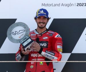 epa09463503 Winner Italian MotoGP rider Francesco Bagnaia of Ducati Lenovo Team celebrates on the podium after the Motorcycling Grand Prix of Aragon at MotorLand Aragon circuit in Alcaniz, Teruel, northern Spain, 12 September 2021.  EPA/JAVIER CEBOLLADA