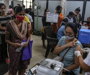 epa09473166 A woman receives a shot of the vaccine against COVID-19 during a special mass vaccination drive for women, in Mumbai, India, 17 September 2021. Brihanmumbai Municipal Corporation (BMC) has organized a special Covid-19 vaccination drive for women, where beneficiaries can get both first and second doses on a walk-in basis at vaccination centers run by state government and civic body.  EPA/DIVYAKANT SOLANKI