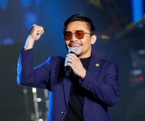 epa09475975 (FILE) - Filipino boxing champion and senator Manny Pacquiao performs during the launch of his own crypto currency in Manila, Philippines 01 September 2019 (reissued 19 September 2021). Pacquiao accepted the nomination of his PDP-Laban party to run for president in 2022, as he said on 19 September 2021.  EPA/MARK R. CRISTINO *** Local Caption *** 55435064