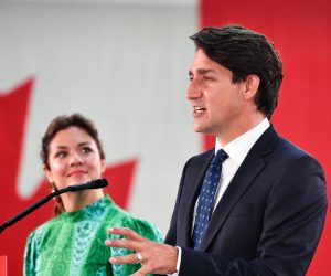 epa09478678 Canadian Prime Minister and Liberal Party leader Justin Trudeau (R), next to his wife Sophie Gregoire (L), addresses supporters as he celebrates his election victory in Montreal, Quebec, Canada, 20 September 2021. Liberal Party leader Justin Trudeau retained his position as Canadian prime minister in the federal election but will be forced to form a minority government.  EPA/ERIC BOLTE