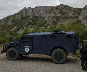 epa09481725 Kosovo Police Special Operations Unit secure the area near the border crossing between Kosovo and Serbia in Jarinje, Kosovo, 22 September 2021. Kosovo Serbs in the northern part of the ethnically divided town of Mitrovica set up road barricades with trucks and cars to protest against the Kosovo government’s entry ban on vehicles with Serbian registration plates.  EPA/VALDRIN XHEMAJ