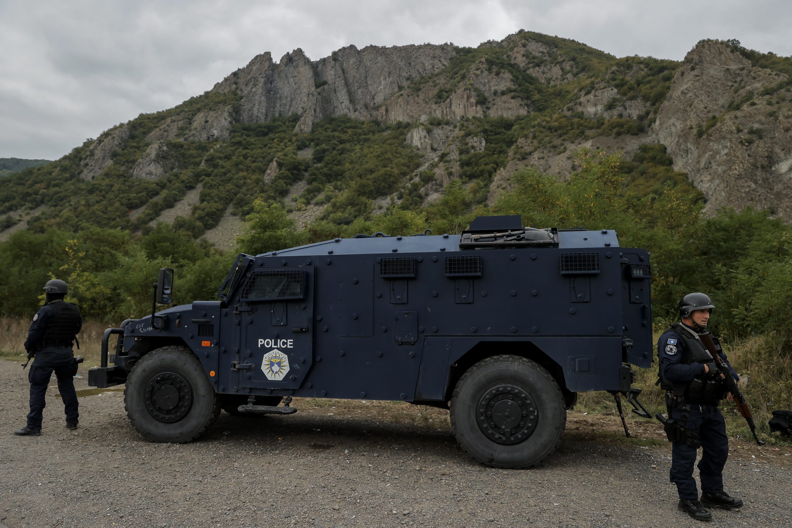 epa09481725 Kosovo Police Special Operations Unit secure the area near the border crossing between Kosovo and Serbia in Jarinje, Kosovo, 22 September 2021. Kosovo Serbs in the northern part of the ethnically divided town of Mitrovica set up road barricades with trucks and cars to protest against the Kosovo government’s entry ban on vehicles with Serbian registration plates.  EPA/VALDRIN XHEMAJ
