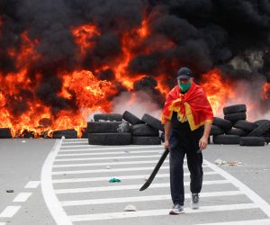 Protest against enthronement of Bishop Joanikije in Cetinje A demonstrator walks in front of a barricade set on fire during a protest against the enthronement of Bishop Joanikije in Cetinje, Montenegro, September 5, 2021. REUTERS/Stevo Vasiljevic STEVO VASILJEVIC