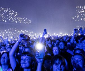 Danish band "The Minds of 99" holds a concert, amid coronavirus disease (COVID-19) outbreak, in Copenhagen's Parken stadium People attend a concert by a Danish band "The Minds of 99" amid the coronavirus disease (COVID-19) outbreak, in Copenhagen's Parken stadium, Denmark, September 11, 2021. Picture taken September 11, 2021. Ritzau Scanpix/Olafur Steinar Gestsson via REUTERS THIS IMAGE HAS BEEN SUPPLIED BY A THIRD PARTY. DENMARK OUT. NO COMMERCIAL OR EDITORIAL SALES IN DENMARK RITZAU SCANPIX