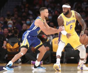 Oct 19, 2021; Los Angeles, California, USA; Los Angeles Lakers forward LeBron James (6) dribbles a ball against Golden State Warriors guard Stephen Curry (30) during the first quarter at Staples Center. Mandatory Credit: Kiyoshi Mio-USA TODAY Sports