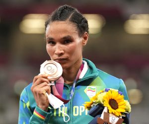 Bronze medalist Letesenbet Gidey, of Ethiopia, reacts during the medal ceremony for the women's 10,000-meters final at the 2020 Summer Olympics, Saturday, Aug. 7, 2021, in Tokyo. (AP Photo/Martin Meissner)