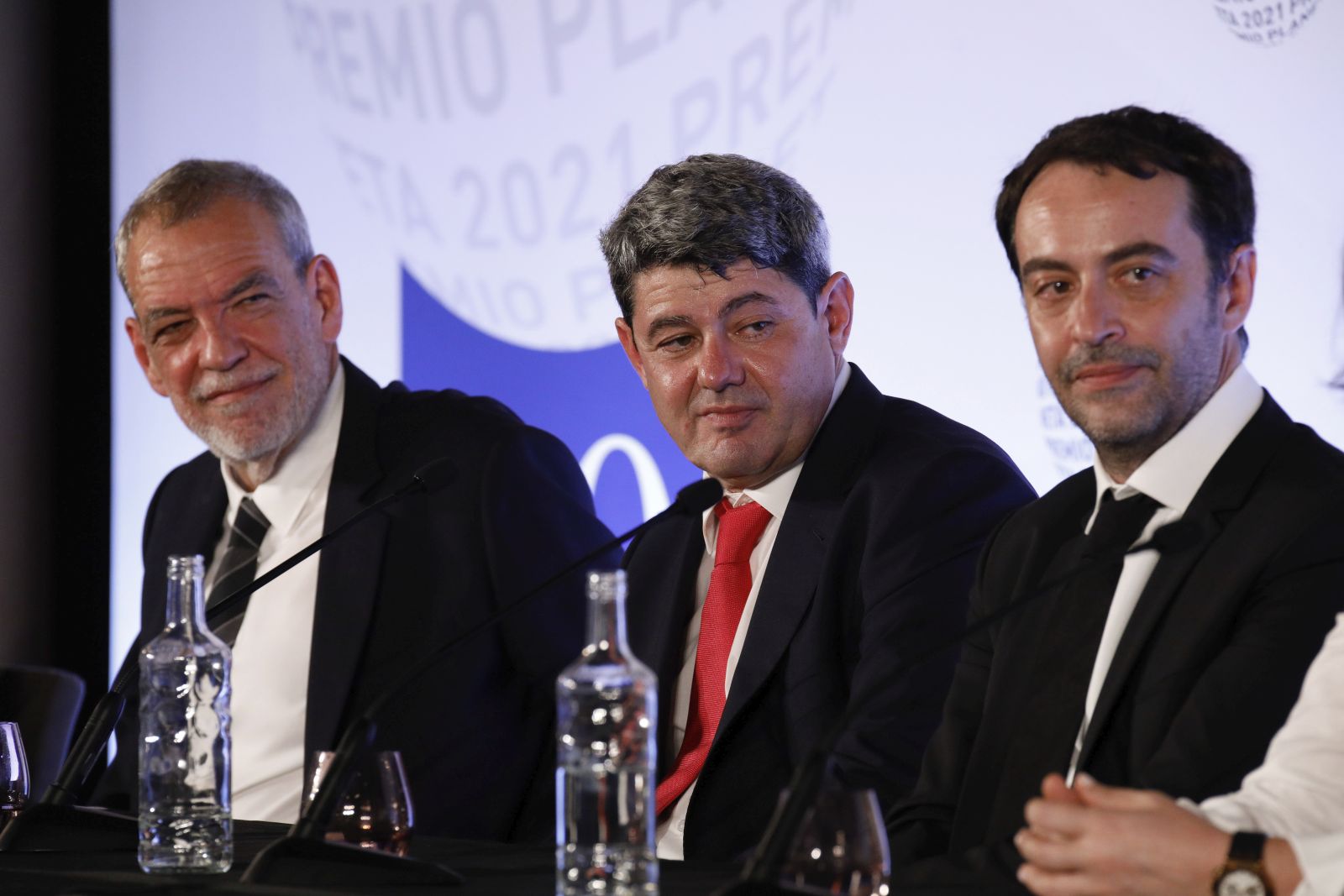 The writer Carmen Mola, pseudonym of the writers Jorge Díaz, Agustín Martínez and Antonio Mercero, winner of the 70th edition of the Planeta Novel Prize, together with the finalist Pilar Sánchez-Garnica give a press conference after the award ceremony, at the Museu Nacional d'Art de Catalunya, on 15 October 2021, in Barcelona, Catalonia (Spain). The Planeta Novel Prize was created in 1952 by José Manuel Lara, with the aim of promoting authors who write in Spanish. The prize is awarded to the author who has managed to convince the jury for his or her originality, attractiveness or for the emotion he or she transmits in his or her novel. The Planeta Novel Prize 2021 is currently endowed with 1,000,000 euros for the winning work and 200,000 euros for the runner-up. Kike Rincón / Europa Press 10/16/2021 (Europa Press via AP)