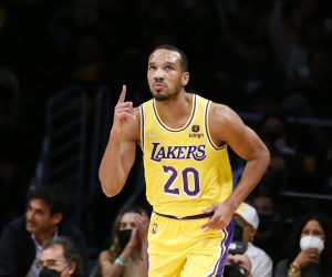Los Angeles Lakers guard Avery Bradley (20) gestures after scoring a 3-pointer against the Golden State Warriors during the second half of an NBA basketball game in Los Angeles, Tuesday, Oct. 19, 2021. The Warriors won 121-114. (AP Photo/Ringo H.W. Chiu)