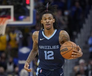 Memphis Grizzlies' Ja Morant brings the ball up during the second half of the team's NBA basketball game against the Golden State Warriors in San Francisco, Thursday, Oct. 28, 2021. (AP Photo/Jeff Chiu)