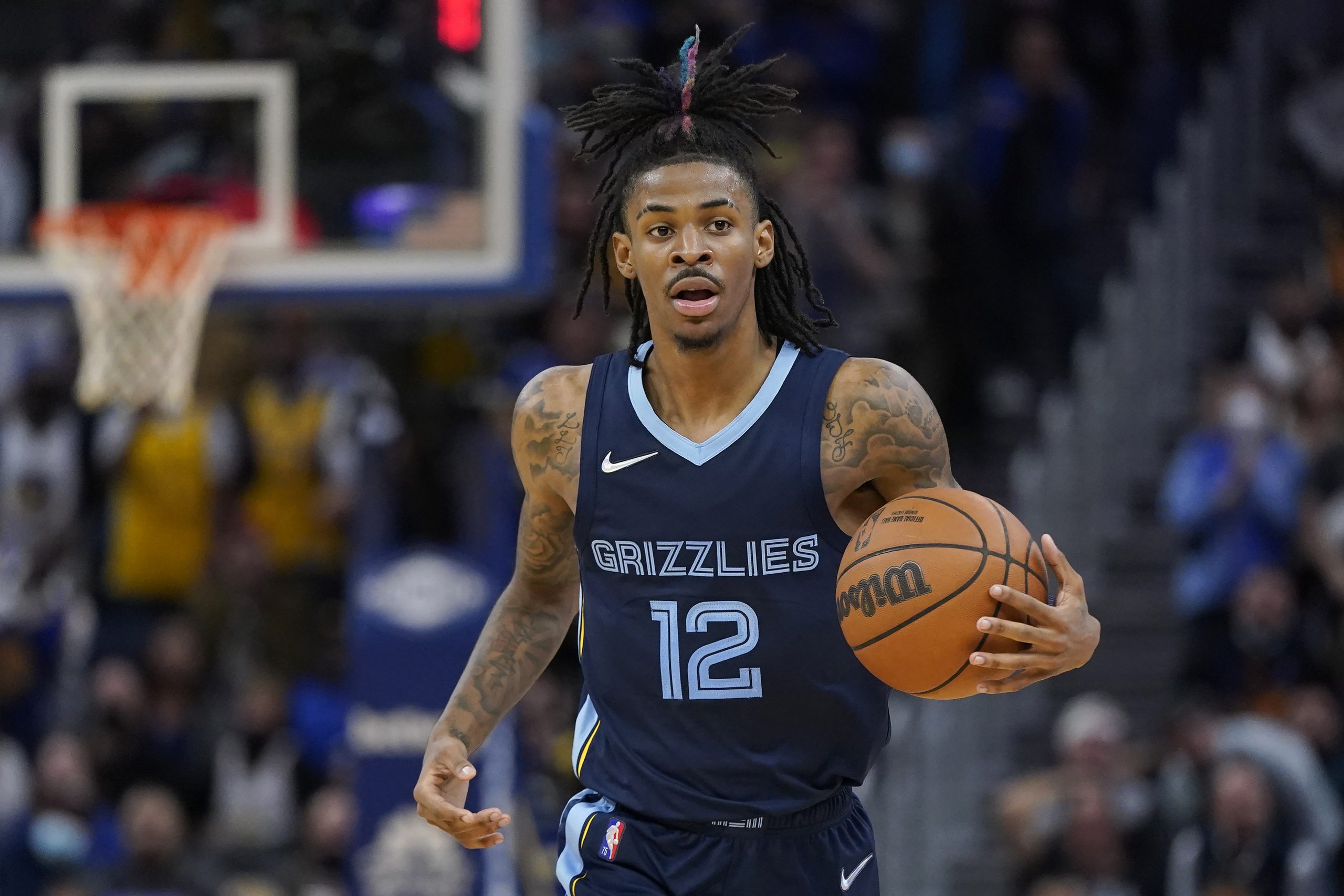 Memphis Grizzlies' Ja Morant brings the ball up during the second half of the team's NBA basketball game against the Golden State Warriors in San Francisco, Thursday, Oct. 28, 2021. (AP Photo/Jeff Chiu)