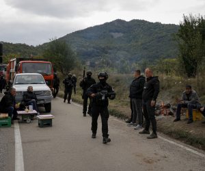 epa09481712 Kosovo Police Special Operations Unit patrol the area near the border crossing between Kosovo and Serbia in Jarinje, Kosovo, 22 September 2021. Kosovo Serbs in the northern part of the ethnically divided town of Mitrovica set up road barricades with trucks and cars to protest against the Kosovo government’s entry ban on vehicles with Serbian registration plates.  EPA/VALDRIN XHEMAJ