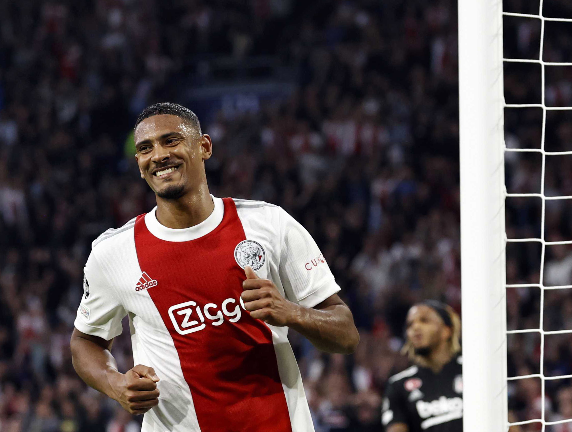 epa09493700 Sebastien Haller of Ajax celebrates scoring the 2-0 lead during the UEFA Champions League group C match between Ajax Amsterdam and Besiktas Istanbul at the Johan Cruijff ArenA in Amsterdam, Netherlands, 28 September 2021.  EPA/MAURICE VAN STEEN