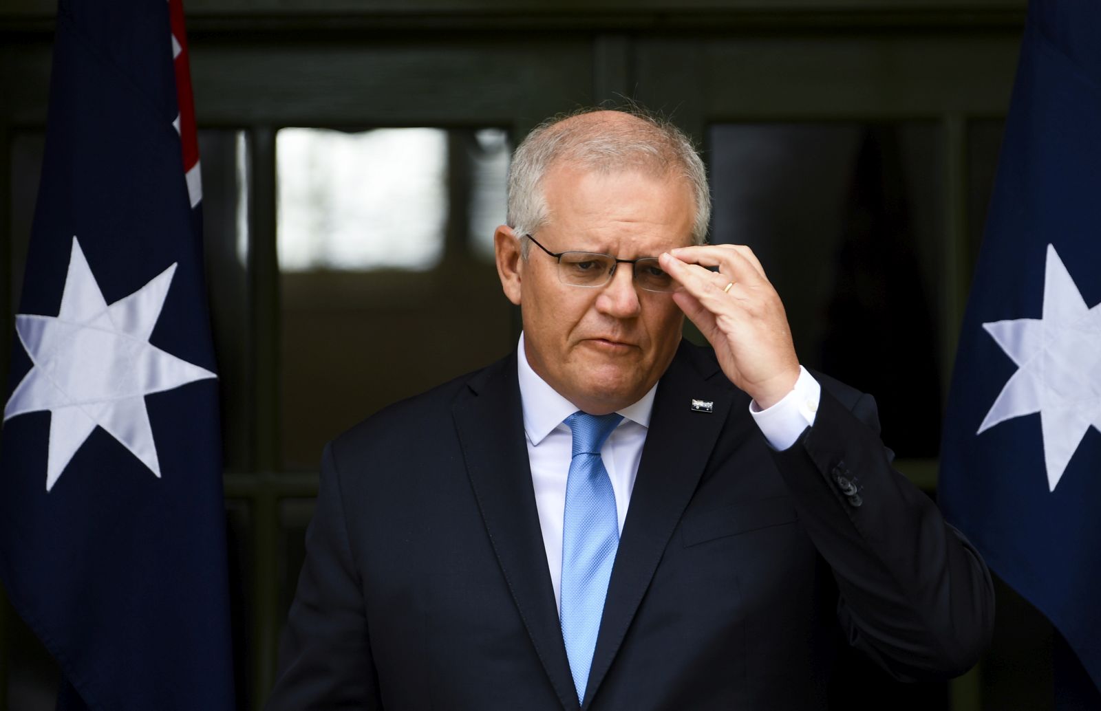 epa09499027 Australian Prime Minister Scott Morrison speaks to the media during a press conference at the Lodge in Canberra, Australian Capital Territory, Australia, 01 October 2021. Prime Minister Morrison announced on the day that Australia is ready to take its next steps to safely reopen to the world and that his government is working 'towards completely quarantine-free travel for certain countries,' when it is safe to do so. Australia's international travel ban is expected to be lifted sometime in November, allowing fully vaccinated Australians overseas to return home.  EPA/LUKAS COCH AUSTRALIA AND NEW ZEALAND OUT