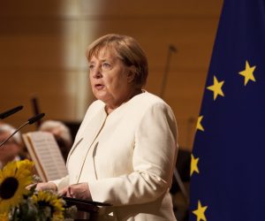 epa09503196 German Chancellor Angela Merkel speaks during a ceremony on the occasion of the Day of German Unity at Haendel Hall in Halle/Saale, Germany, 03 October 2021.  EPA/JOHANNES STEIN / POOL
