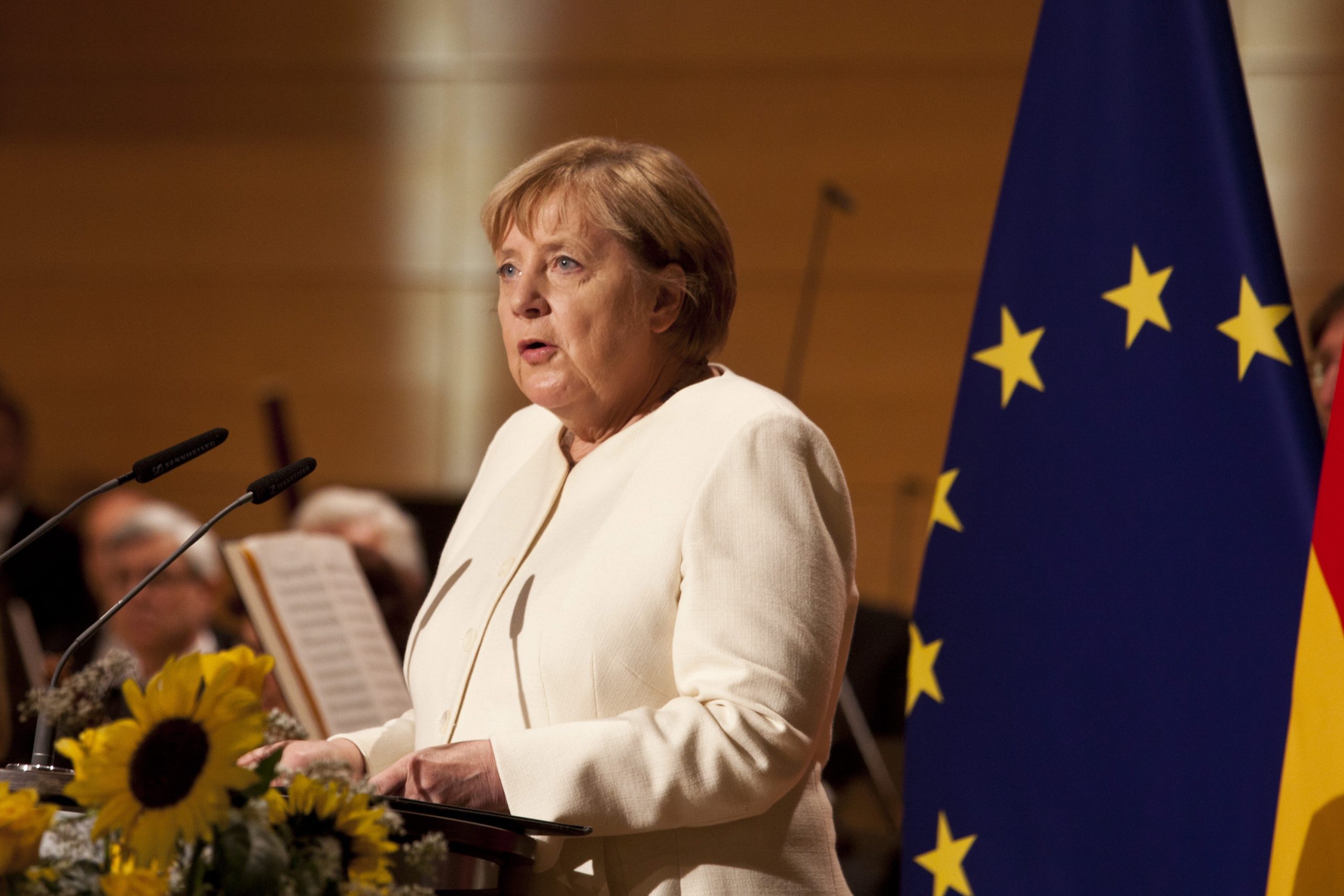 epa09503196 German Chancellor Angela Merkel speaks during a ceremony on the occasion of the Day of German Unity at Haendel Hall in Halle/Saale, Germany, 03 October 2021.  EPA/JOHANNES STEIN / POOL