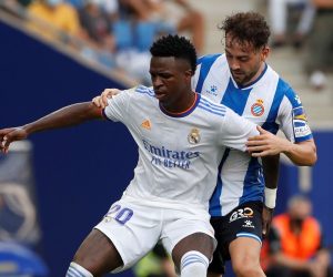 epa09503694 Espanyol's midfielder Keidi Bare (R) in action against Real Madrid's Brazilian winger Vinicius Jr (L) during the Spanish LaLiga soccer match between RCD Espanyol and Real Madrid at RCD Stadium in Barcelona, Catalonia, Spain, 03 October 2021.  EPA/Alberto Estevez