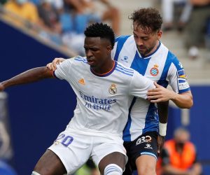 epa09503694 Espanyol's midfielder Keidi Bare (R) in action against Real Madrid's Brazilian winger Vinicius Jr (L) during the Spanish LaLiga soccer match between RCD Espanyol and Real Madrid at RCD Stadium in Barcelona, Catalonia, Spain, 03 October 2021.  EPA/Alberto Estevez