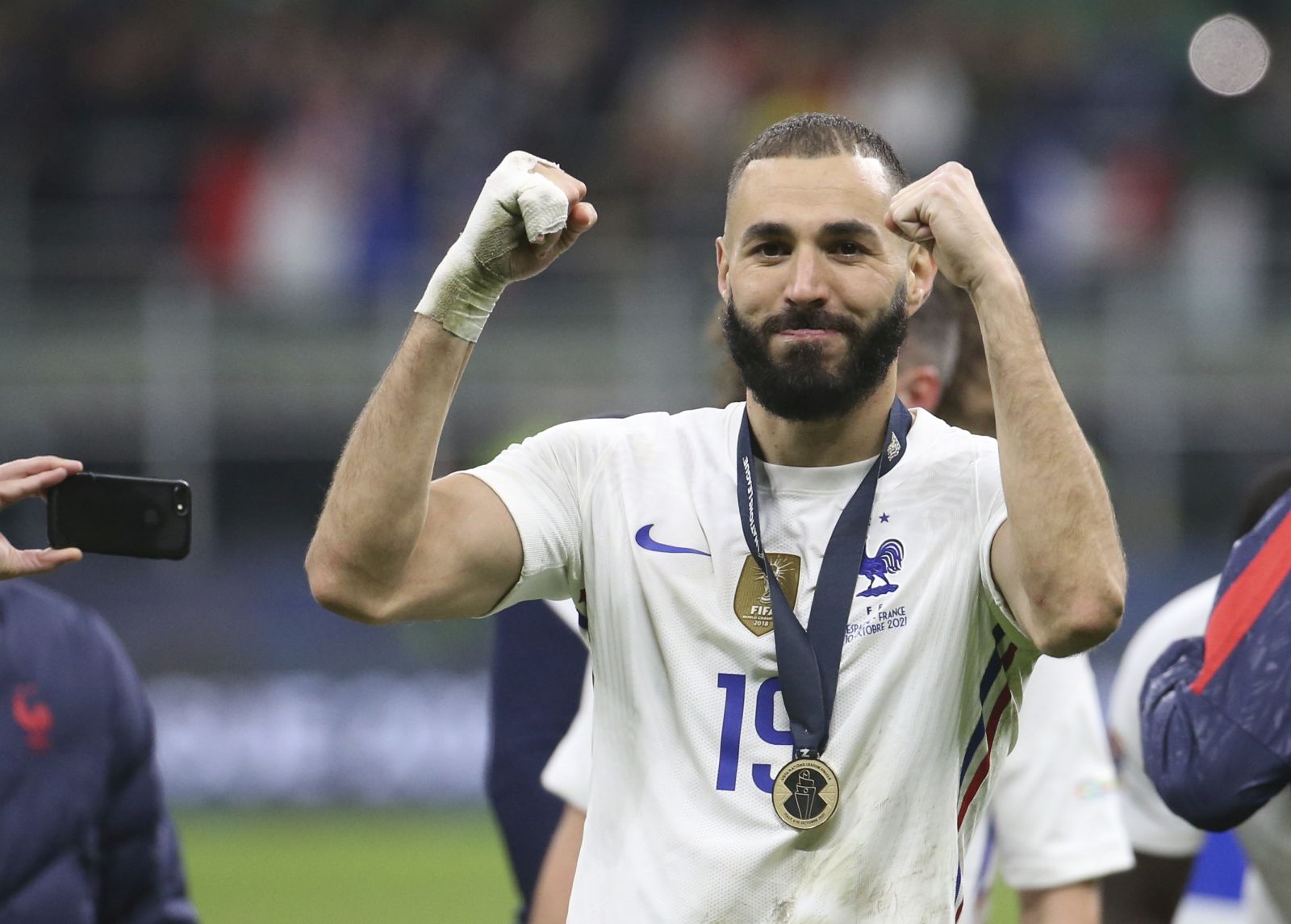 epa09517620 France's Karim Benzema celebrates after the UEFA Nations League final soccer match between Spain and France in Milan, Italy, 10 October 2021.  EPA/MATTEO BAZZI