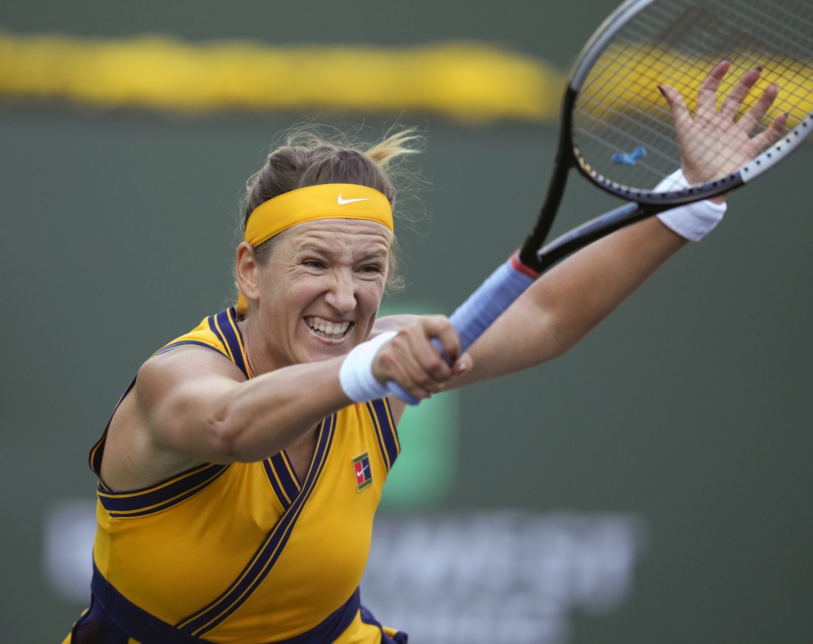 epa09522625 Victoria Azarenka of Belarus in action against Jessica Pegula of the US at the BNP Paribas Open tennis tournament at the Indian Wells Tennis Garden in Indian Wells, California, USA, 13 October 2021.  EPA/RAY ACEVEDO