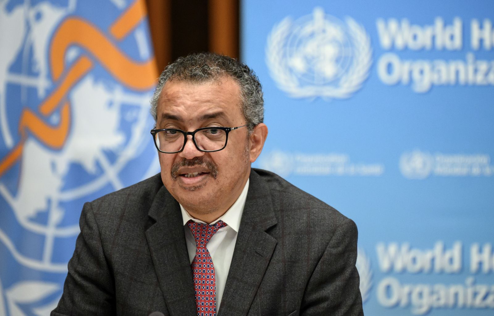 epa09529945 World Health Organization (WHO) Director-General Tedros Adhanom Ghebreyesus delivers a speech during the launch of a multiyear partnership with Qatar on making the FIFA Football World Cup 2022 and mega sporting events healthy and safe, at the WHO headquarters in Geneva, Switzerland,  18 October 2021.  EPA/FABRICE COFFRINI / POOL