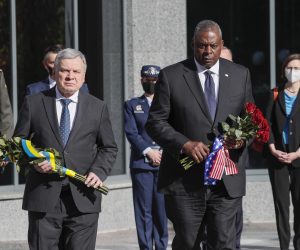 epa09531574 U.S. Defense Secretary Lloyd Austin (R) and Ukrainian Defence Minister Andriy Taran (L) visit a pantheon commemorating fallen defenders of Ukraine prior to their meeting in Kyiv, Ukraine, 19 October 2021.  EPA/GLEB GARANICH / POOL