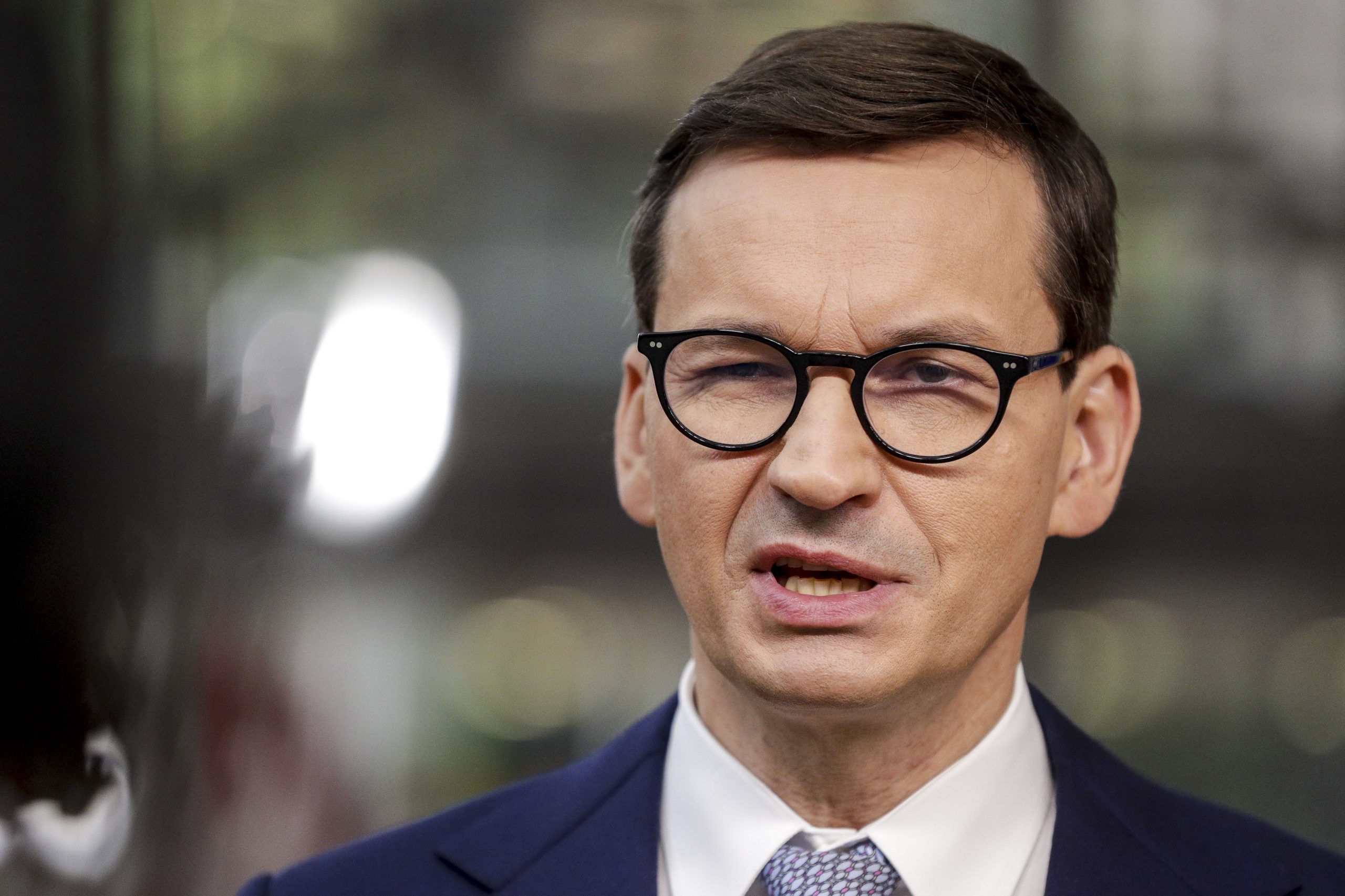 epa09535828 Poland's Prime Minister Mateusz Morawiecki talks to journalists as he arrives to attend an EU summit in Brussels, Belgium, 21 October 2021. EU leaders meet in Brussels on 21 and 22 October, to discuss COVID-19, digital transformation, energy prices, migration, trade and external relations.  EPA/OLIVIER HOSLET / POOL