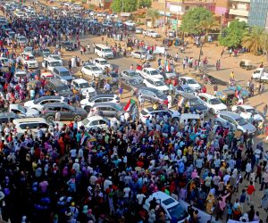 epa09537118 People attend demonstrations in support of the civilian government, in Khartoum, Sudan, 21 October 2021. Thousands of people marched during a demonstration called by the Alliance of Forces for Freedom and Change, the Central Council Group to support the government of Abdullah Hamdok, while the army and police forces closed the roads leading to government headquarters and main markets.  EPA/MOHAMMED ABU OBAID