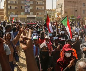 epa09553965 Thousands of people shout slogans and hold national flags during anti-coup protests as a part of nationwide demonstrations after miltary took over the government on 25 October, in the capital Khartoum, Sudan, 30 October 2021. Sudan's military launched a coup attempt on 25 October and arrested the Prime Minister and other senior ministers and civilian members of the Transitional Sovereignty Council during early morning raids.  EPA/STR