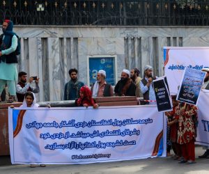 epa09485682 Afghans hold banners and placards as they demand the US to unfreeze the Afghan assets and money it has seized after Taliban took over, during a protest in Kabul, Afghanistan, 24 September 2021. The US administered had frozen billions in Afghan gold, investments and foreign currency reserves parked in the United States. The economic crisis threatened to push 97 percent of the 40 million people into poverty by mid-2022, the United Nations has warned.  EPA/STRINGER