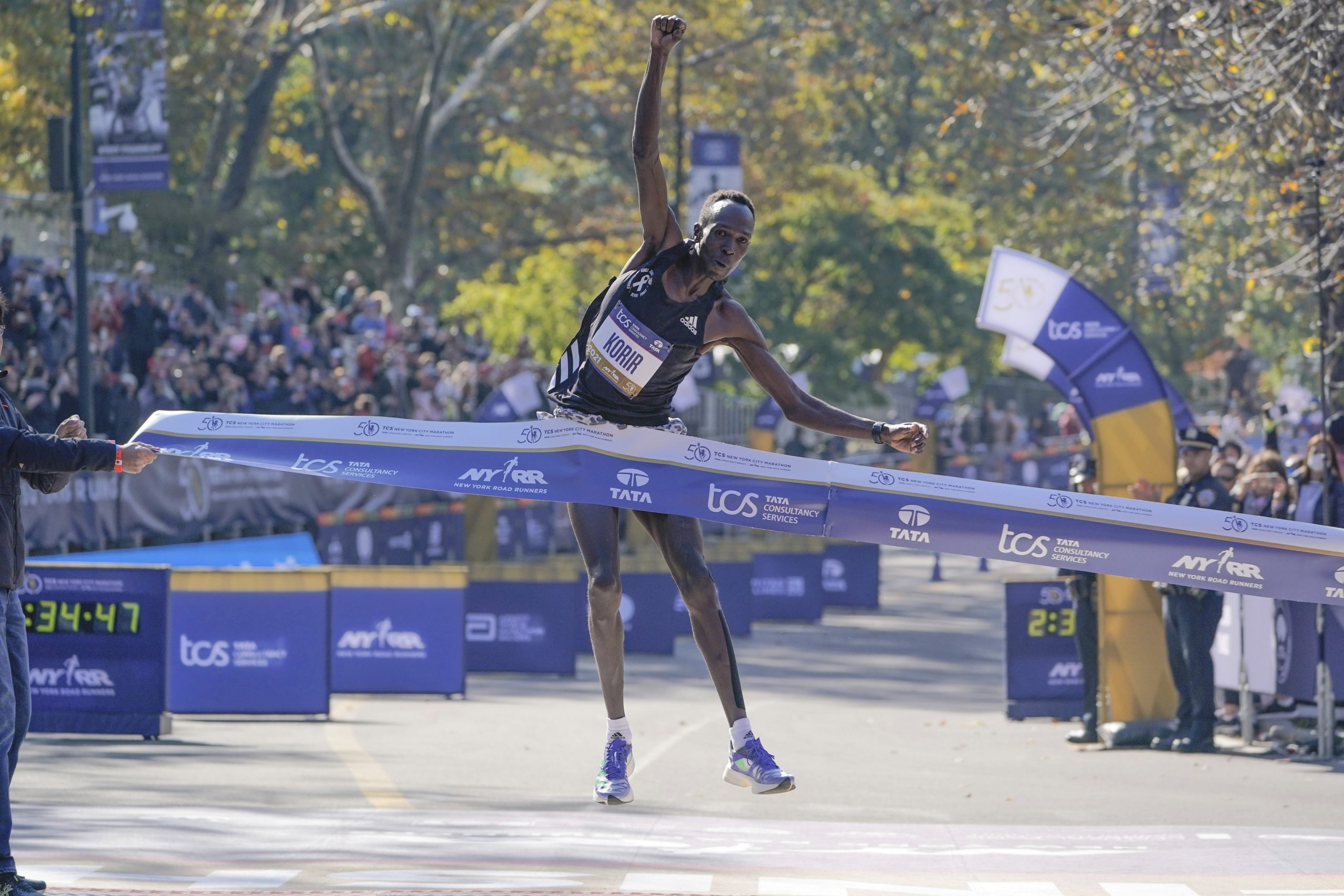 Albert Korir of Kenya crosses the finish line first in the men's division of the New York City Marathon in New York, Sunday, Nov. 7, 2021. (AP Photo/Seth Wenig)