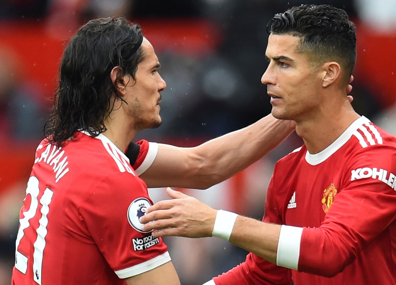 epa09501506 Cristiano Ronaldo (R) of Manchester United replaces Edinson Cavani (L) during the English Premier League soccer match between Manchester United and Everton FC in Manchester, Britain, 02 October 2021.  EPA/Peter Powell EDITORIAL USE ONLY. No use with unauthorized audio, video, data, fixture lists, club/league logos or 'live' services. Online in-match use limited to 120 images, no video emulation. No use in betting, games or single club/league/player publications