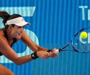 epa09533973 Garbine Muguruza of Spain in action against Tereza Martincova of the Czech Republic during their women's second round match at the Kremlin Cup tennis tournament in Moscow, Russia, 20 October 2021.  EPA/SERGEI ILNITSKY
