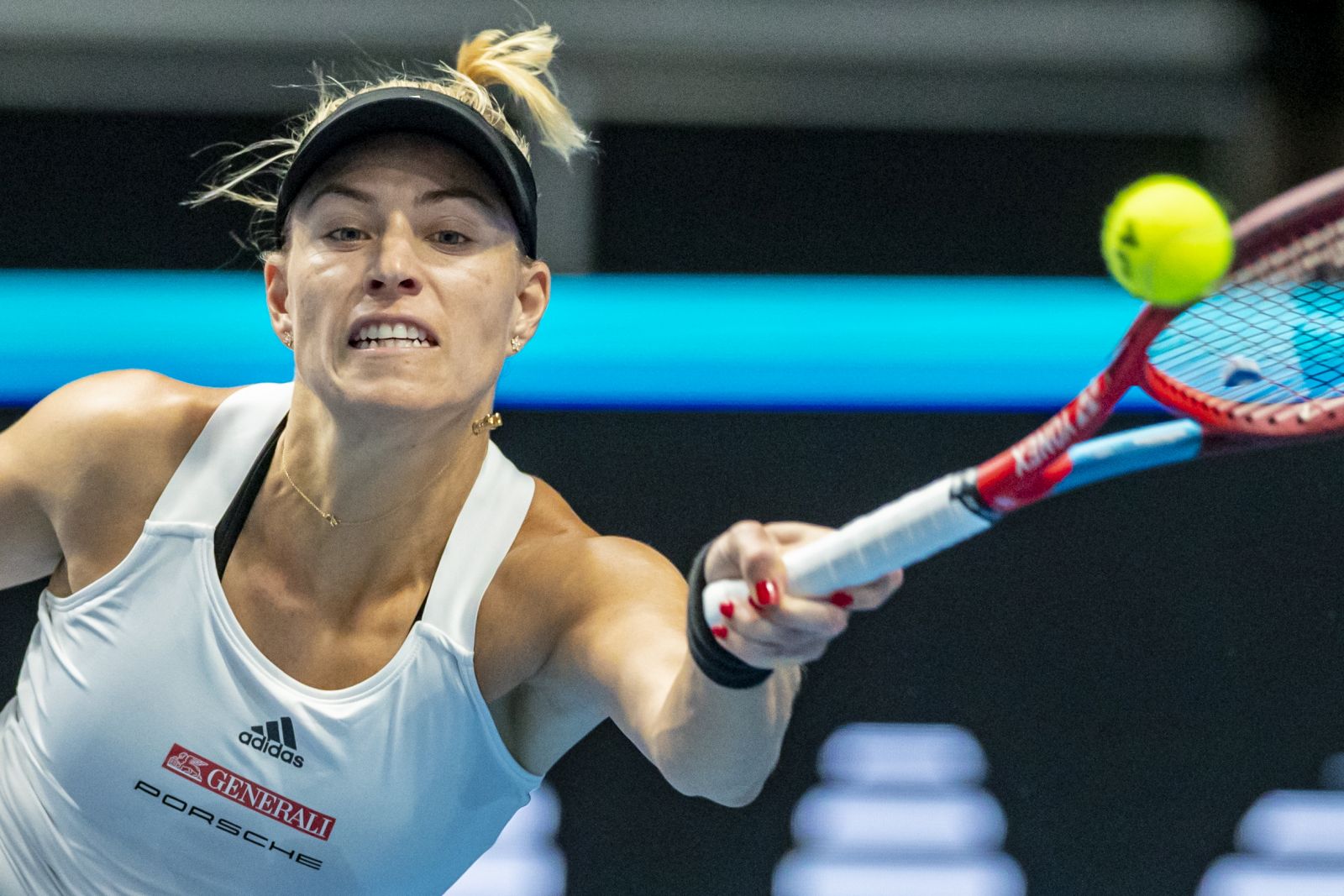 epa09560064 Angelique Kerber of Germany in action during her tennis match against Belinda Bencic of Switzerland at the Billie Jean King Trophy 2021 Finals in Prague, Czech Republic, 02 November 2021. Billie Jean King Trophy Finals matches will be held till 06 November 2021 in Prague.  EPA/MARTIN DIVISEK