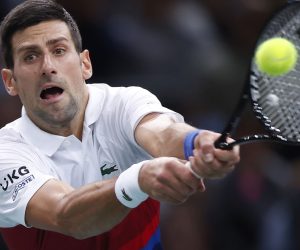 epa09560332 Novak Djokovic of Serbia in action during his first round match against Marton Fucsovics of Hungary at the Rolex Paris Masters tennis tournament in Paris, France, 02 November 2021.  EPA/IAN LANGSDON