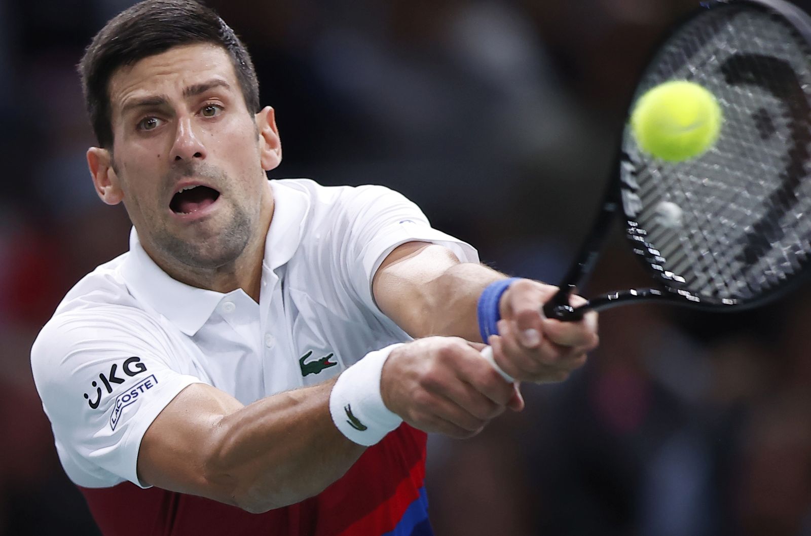 epa09560332 Novak Djokovic of Serbia in action during his first round match against Marton Fucsovics of Hungary at the Rolex Paris Masters tennis tournament in Paris, France, 02 November 2021.  EPA/IAN LANGSDON