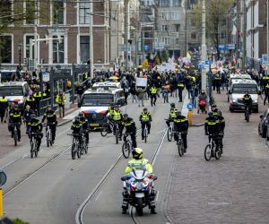 epa09570315 Opponents of the corona measures take part in a protest march through the center of The Hague during the Together for the Netherlands manifestation in the Hague, the Netherlands, 07 November 2021.  EPA/ROBIN VAN LONKHUIJSEN