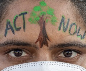 epa09571102 A Nepalese protester looks on during a Climate change protest to demand action from world leaders to combat the climate change crisis, in Kathmandu, Nepal, 08 November 2021.The 2021 United Nations Climate Change Conference (COP26) runs from 31 October to 12 November 2021 in Glasgow.  EPA/NARENDRA SHRESTHA