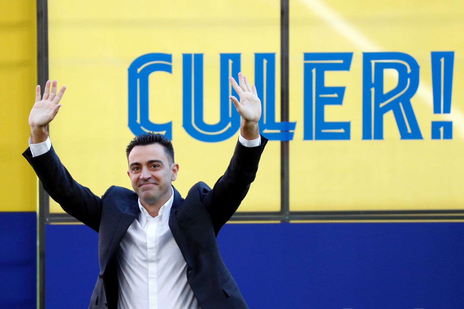 epa09571156 FC Barcelona's new head coach, Xavi Hernandez, waves to fans during his presentation at Camp Nou stadium in Barcelona, Spain, 08 November 2021. Xavi Hernandez left Al-Sadd club of Qatar to lead FC Barcelona for the rest of the current season and two more seasons.  EPA/Alejandro García