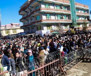 epa09579916 Afghans gather outside the passport office as Taliban resumes issuing passports, in Kabul, Afghanistan, 13 November 2021. The Taliban, on 06 October, began issuing current passports under the name of the Islamic Republic of Afghanistan, even though they have begun referring to the country as the Islamic Emirate of Afghanistan after taking over on 15 August 2021, Around 170,000 Afghans have applied for passports after the Taliban victory led to the suspension of commercial flights even as international evacuations kicked off from Kabul and continued until 31 August, the deadline for the withdrawal of the remaining United States troops in the country after two decades of occupation.  EPA/STRINGER