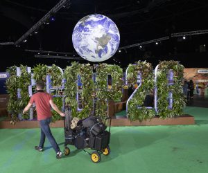 epaselect epa09579988 A workman removes equipment in the Hydro COP26 venue during the 26th UN Climate Change Conference, in Glasgow, Britain, 13 November 2021.  EPA/ROBERT PERRY
