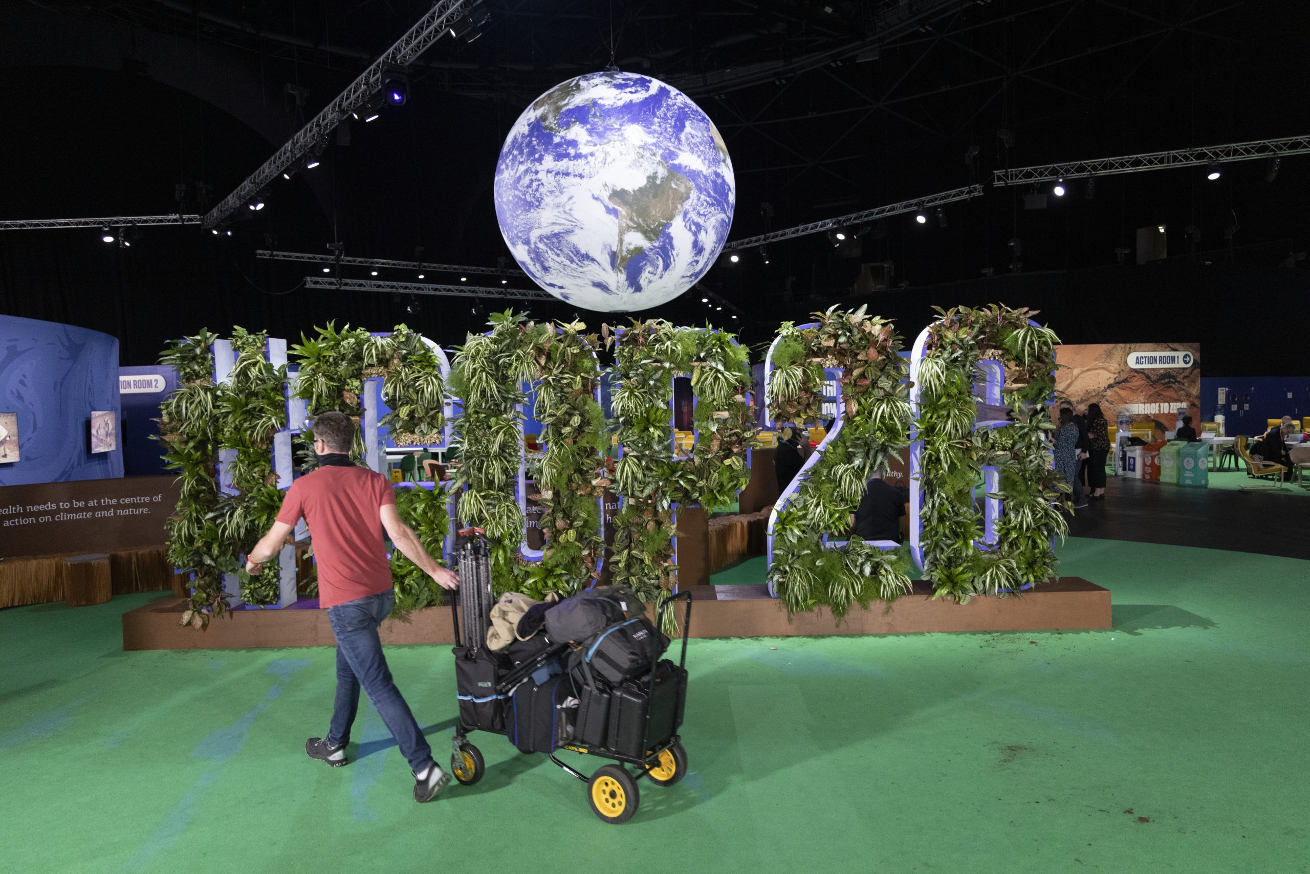 epaselect epa09579988 A workman removes equipment in the Hydro COP26 venue during the 26th UN Climate Change Conference, in Glasgow, Britain, 13 November 2021.  EPA/ROBERT PERRY
