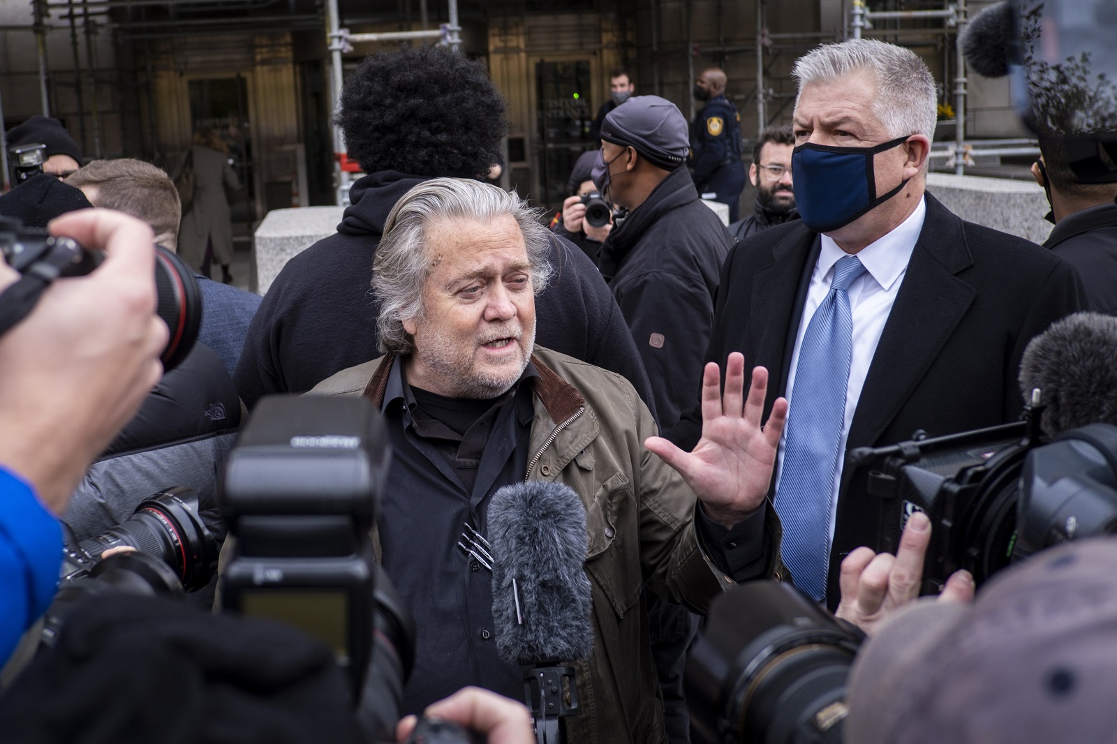 epa09583536 Trump ally and former White House adviser Steve Bannon (C) arrives to turn himself into authorities at the FBI Field Office in Washington, DC, USA, 15 November 2021. Bannon surrendered to authorities after being indicted on two counts of contempt of Congress for defying the Jan. 6 committee request for documents and testimony related to the riot at the Capitol.  EPA/PETE MAROVICH